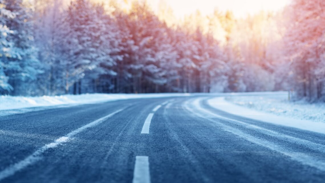 winter road, covered with snow on sunny day