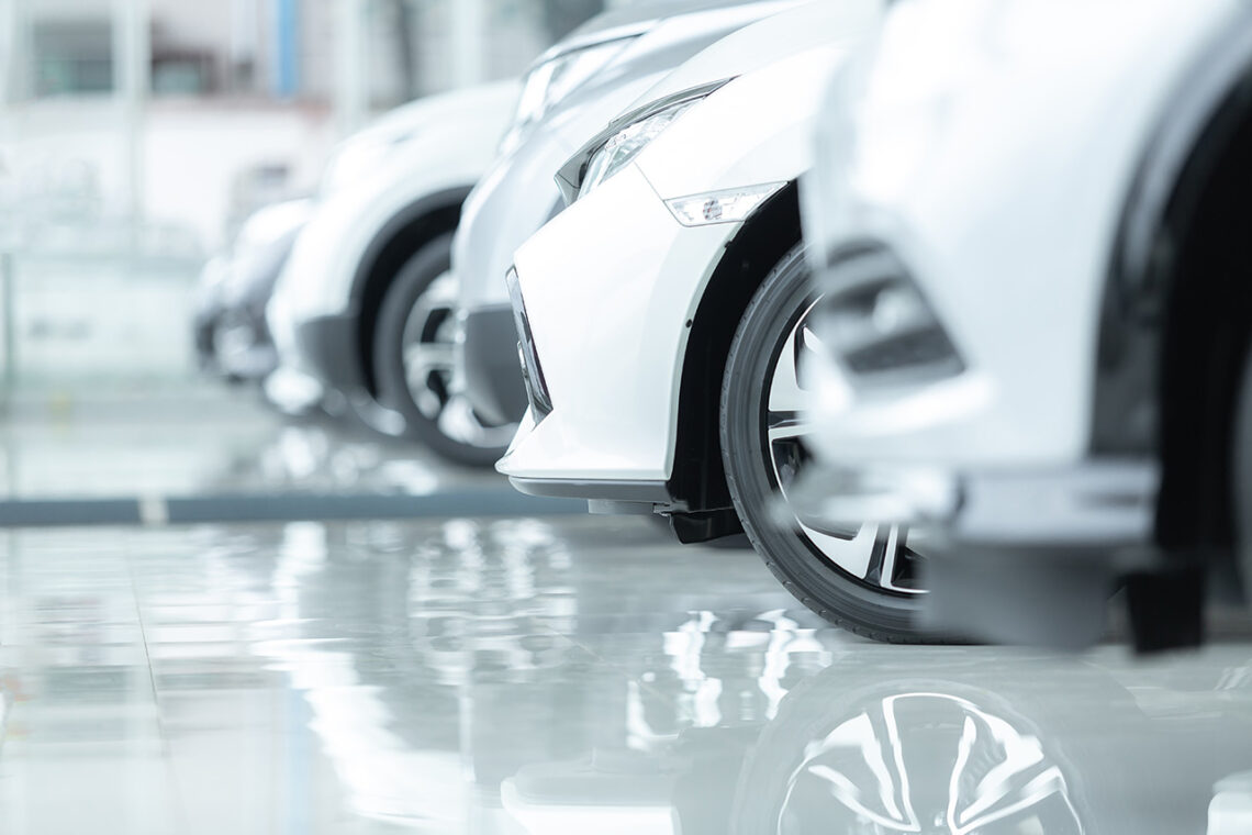Cars For Sale, Automotive Industry, Cars Dealership Parking Lot. Rows of Brand New Vehicles Awaiting New Owners, on the epoxy floor in new car service